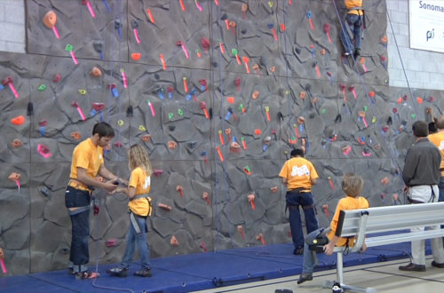 Boys and Girls Club of Sonoma members climb on the new climbing wall in their clubhouse.