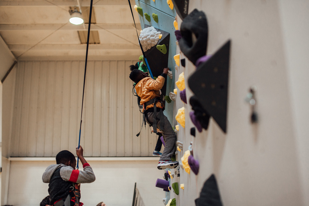 Saint Louis Boys and Girls club members try climbing for the first time.