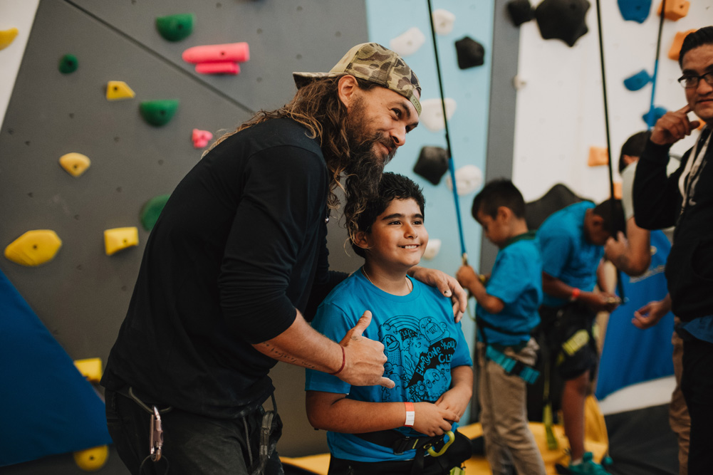 Jason Momoa hangs with a LA Variety Boys and Girls Club member.