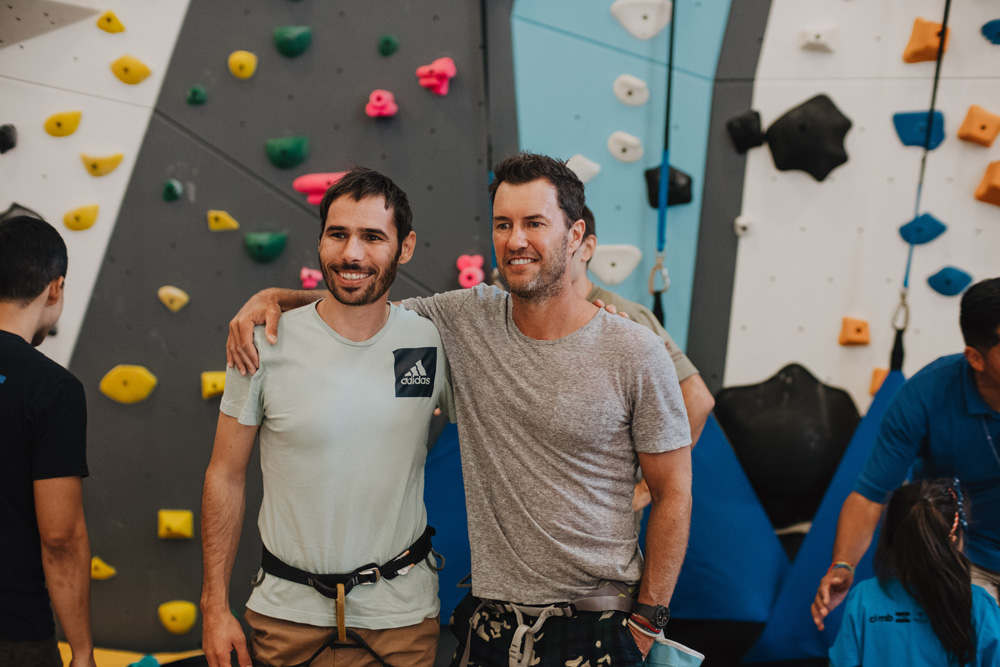Kevin and TOMS founder Blake Mycoskie at the LA Variety Boys and Girls Club climbing wall opening.