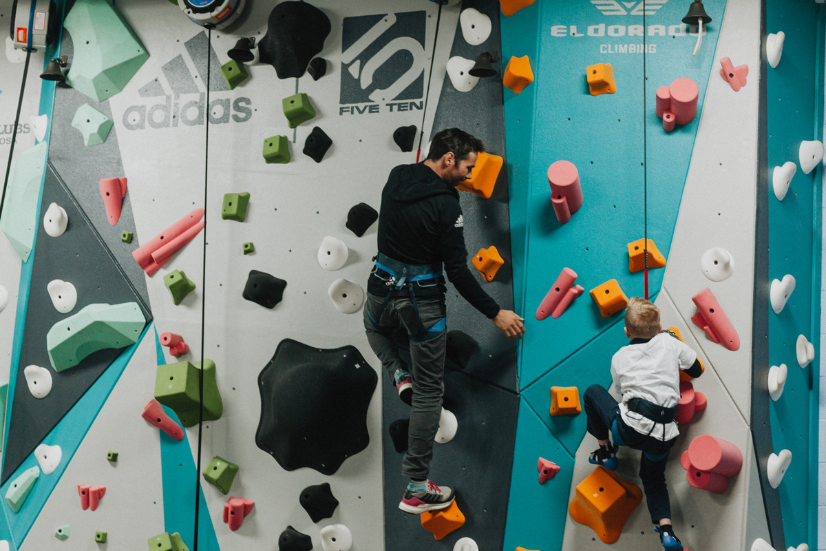 1 climb co founder kevin jorgeson helps a boys and girls club member climb up the new 1climb wall in santa rosa